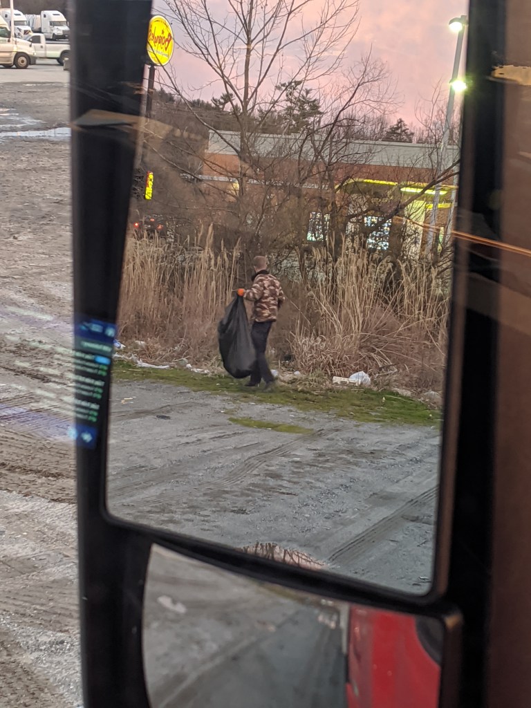 Collecting trash at a truck stop as a mode of environmental action. 