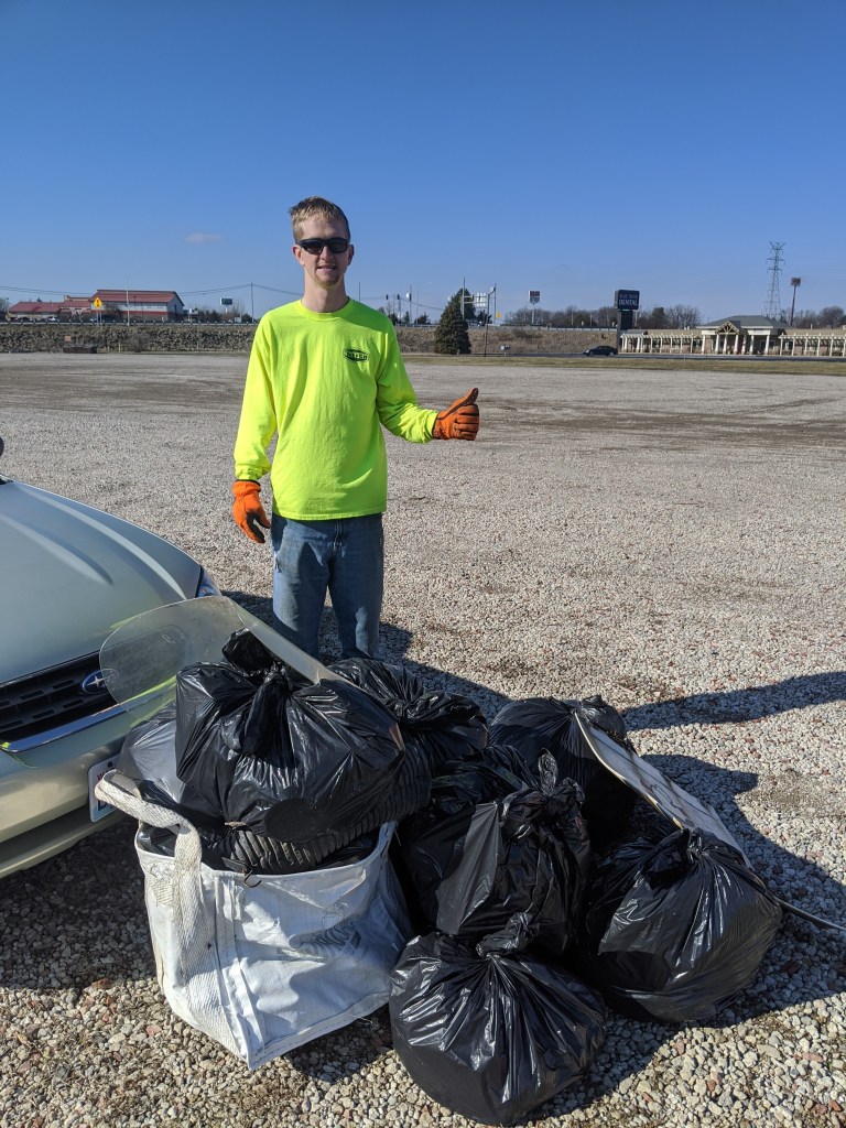 Collecting trash at a truck stop as environmental activism. Demonstrates the power of collective action if more people take on the challenge.